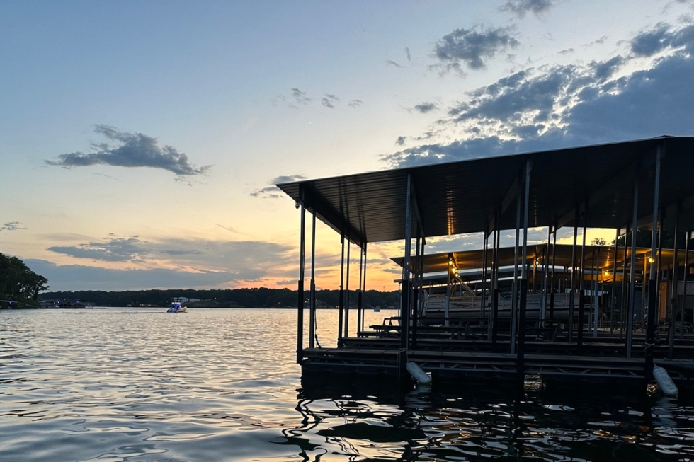 Docks on lake of the ozarks with sunset in background